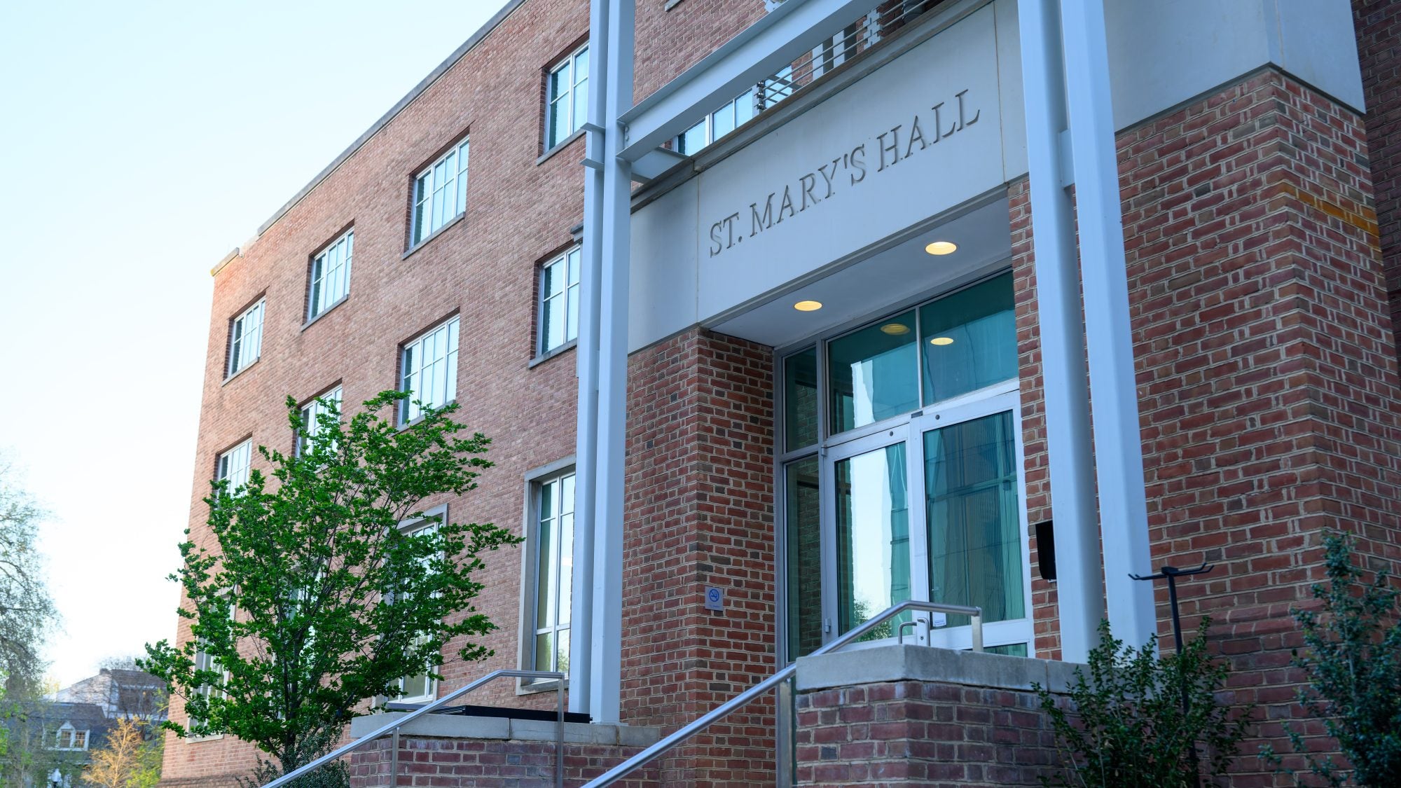 A brick building that says &quot;St. Mary&#039;s Hall&quot; on the front entrance