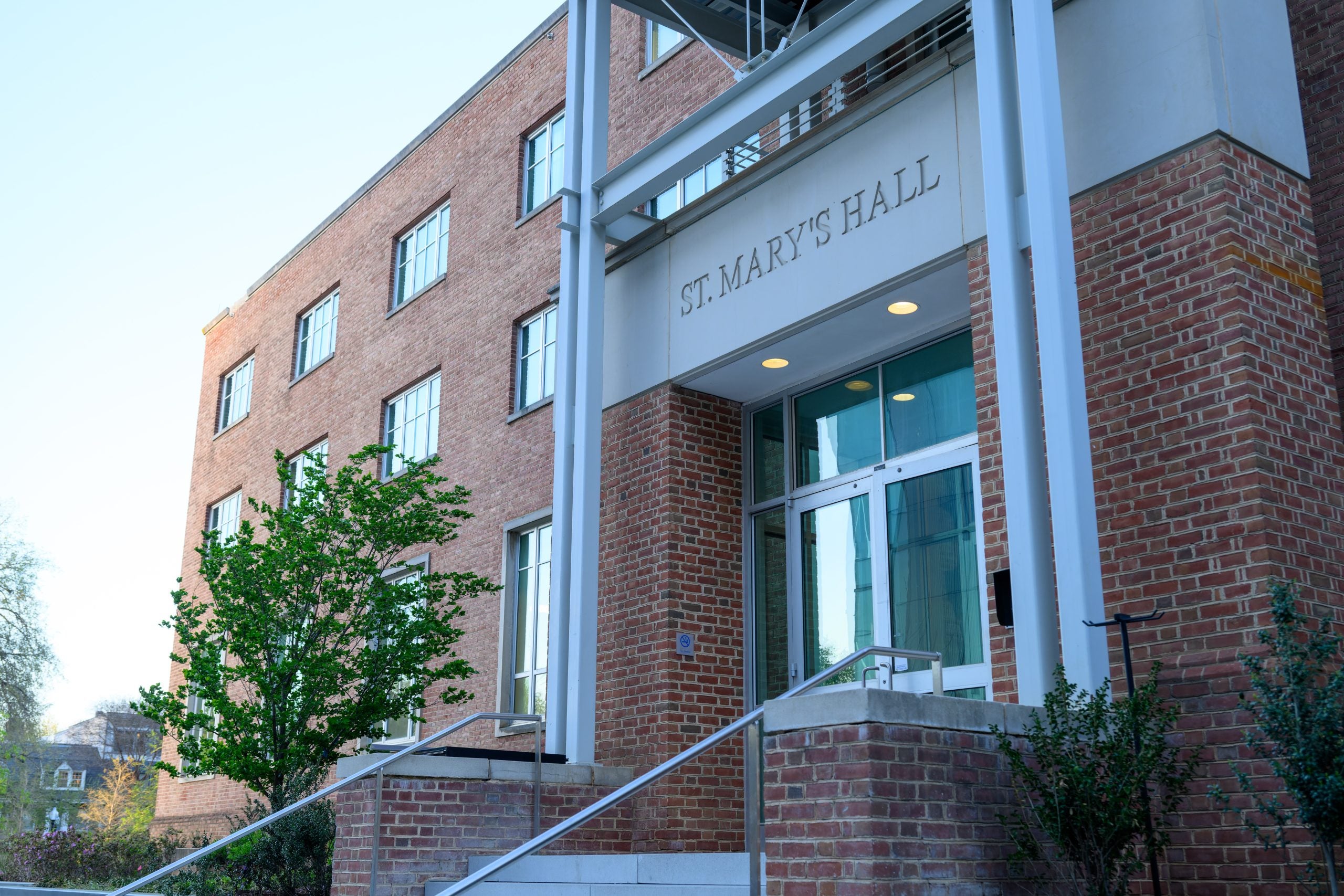 A brick building that says "St. Mary's Hall" on the front entrance