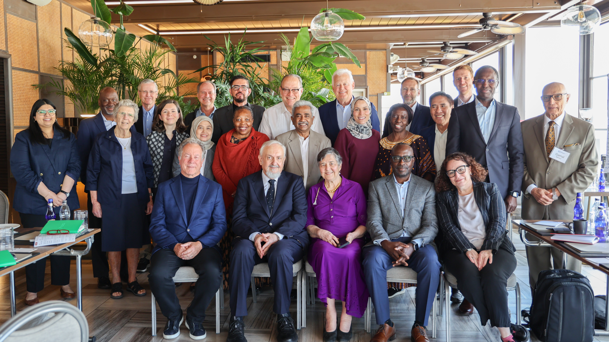 A group of people pose together in a formal photo