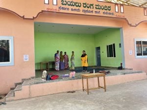 Women at a building in India