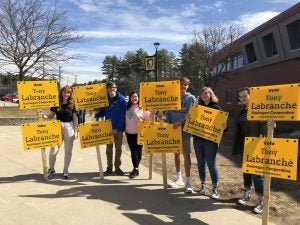 Tony and his friends with campaign signs