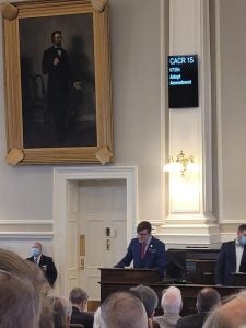 Labranche speaking at a podium