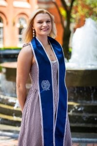Lisa in a dress and a grad stole