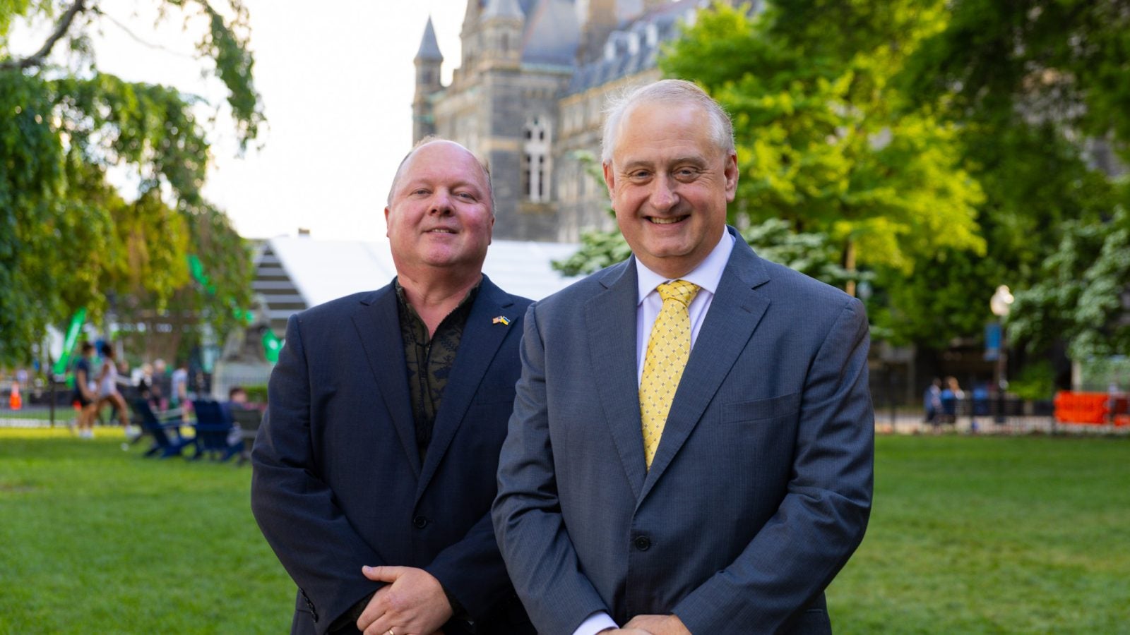 Alan Himmer and Paul Shmotolokha on Healy Lawn in suits