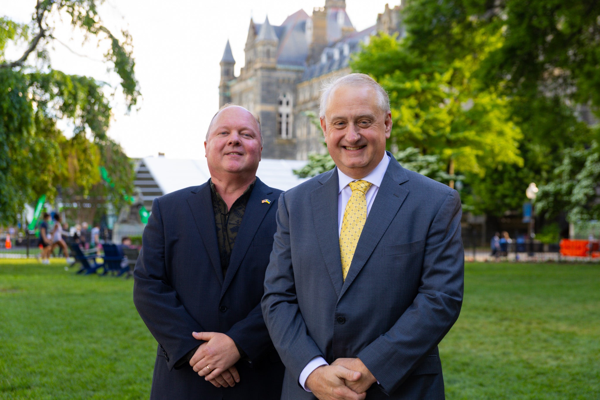 Alan Himmer and Paul Shmotolokha on Healy Lawn in suits