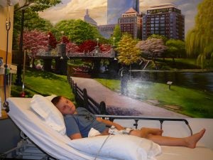 Tony in a hospital bed as a child