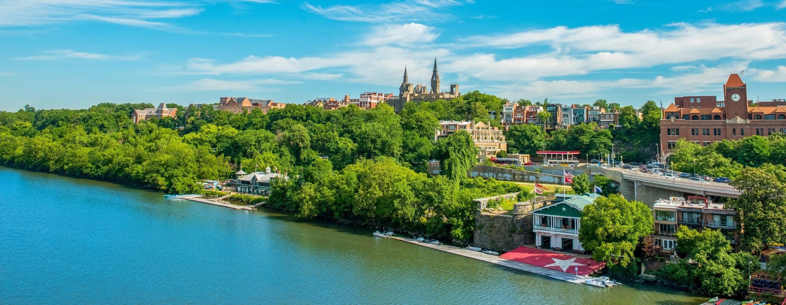 The Potomac River and Georgetown's campus on a sunny day