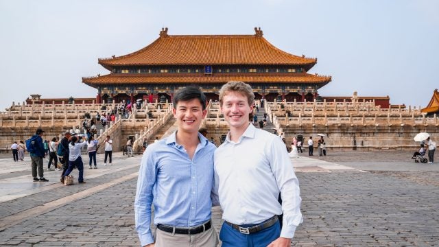 Bennie and Luke in front of a palace