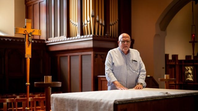 Ray Kemp at the altar in Dahlgren Chapel