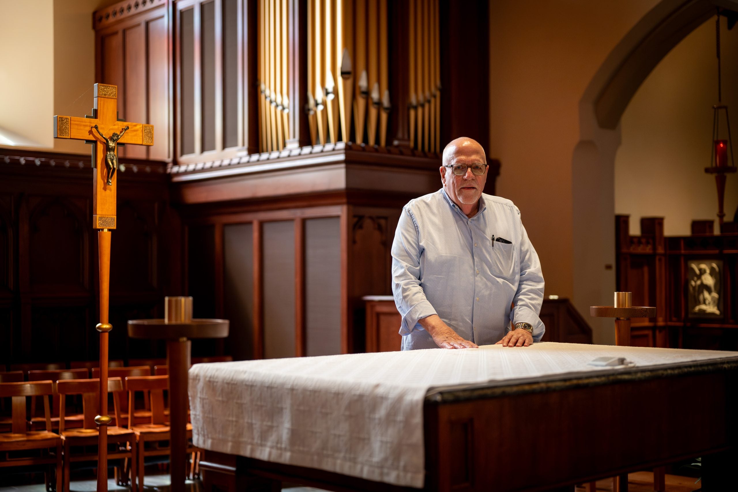 Ray Kemp at the altar in Dahlgren Chapel