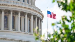 The American flag outside the U.S. Capitol building