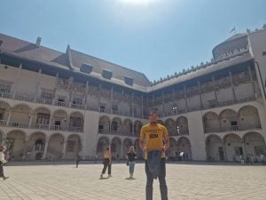 Obinna at a castle in Poland on a sunny day