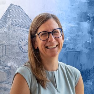 A woman wearing glasses smiles in front of a graphic of a clocktower