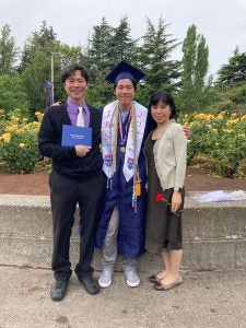 Jeremy with his mother and father at his high school graduation