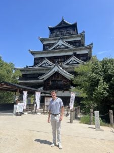 Luke outside of a Japanese castle