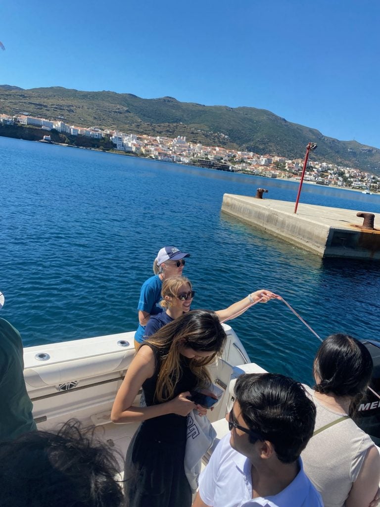 A student collects samples off a boat in Greece