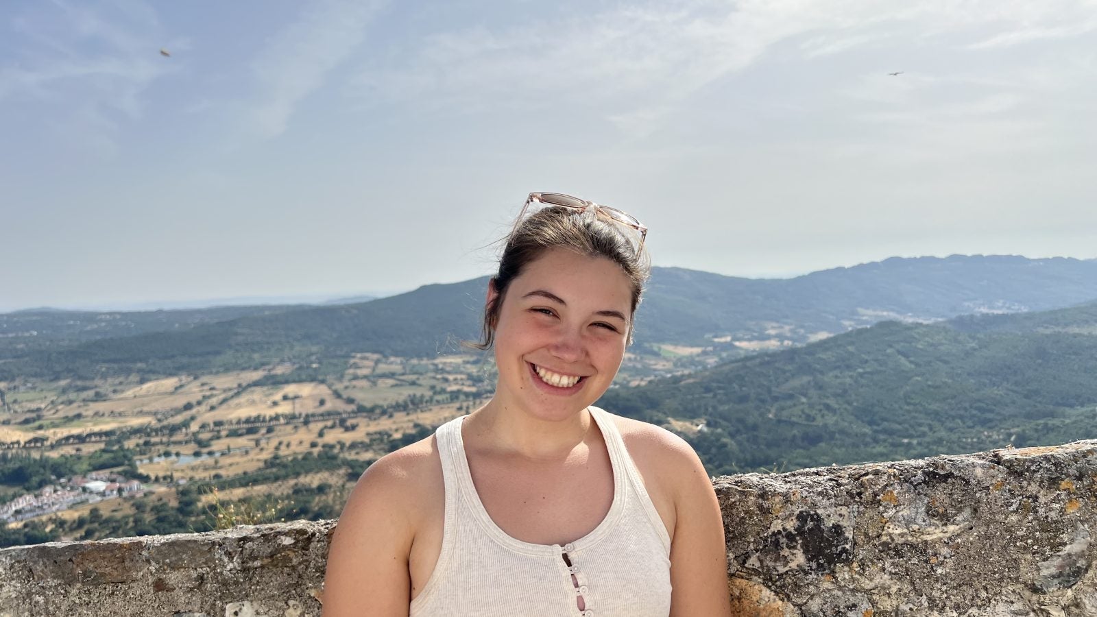 Caroline Sewell on a sunny day overlooking a valley in Portugal