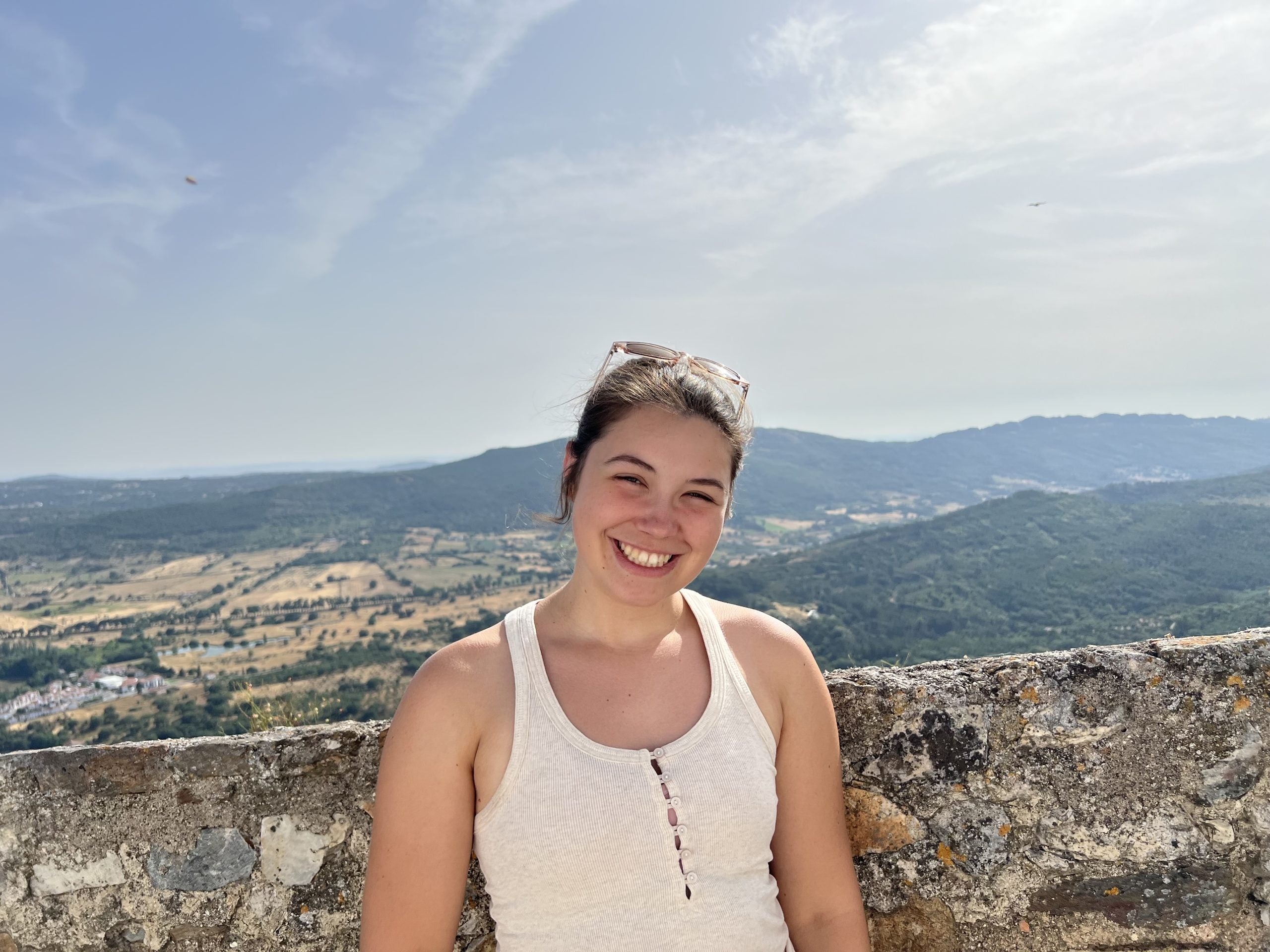 Caroline Sewell on a sunny day overlooking a valley in Portugal