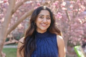 Harnoor in a blue blouse on a sunny spring day