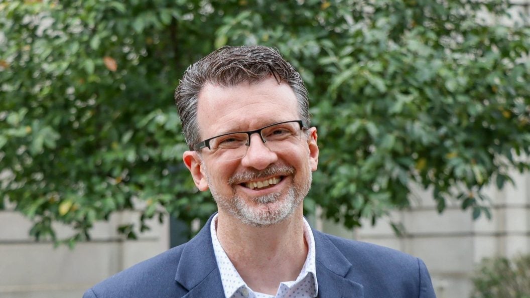 A headshot of Dewey Murdick