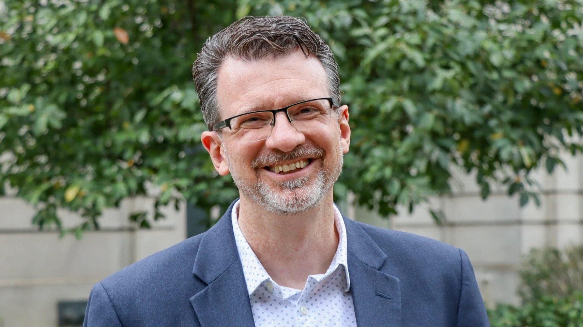A headshot of Dewey Murdick