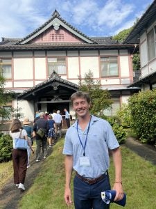 Luke Hughes wearing a blue shirt in Japan