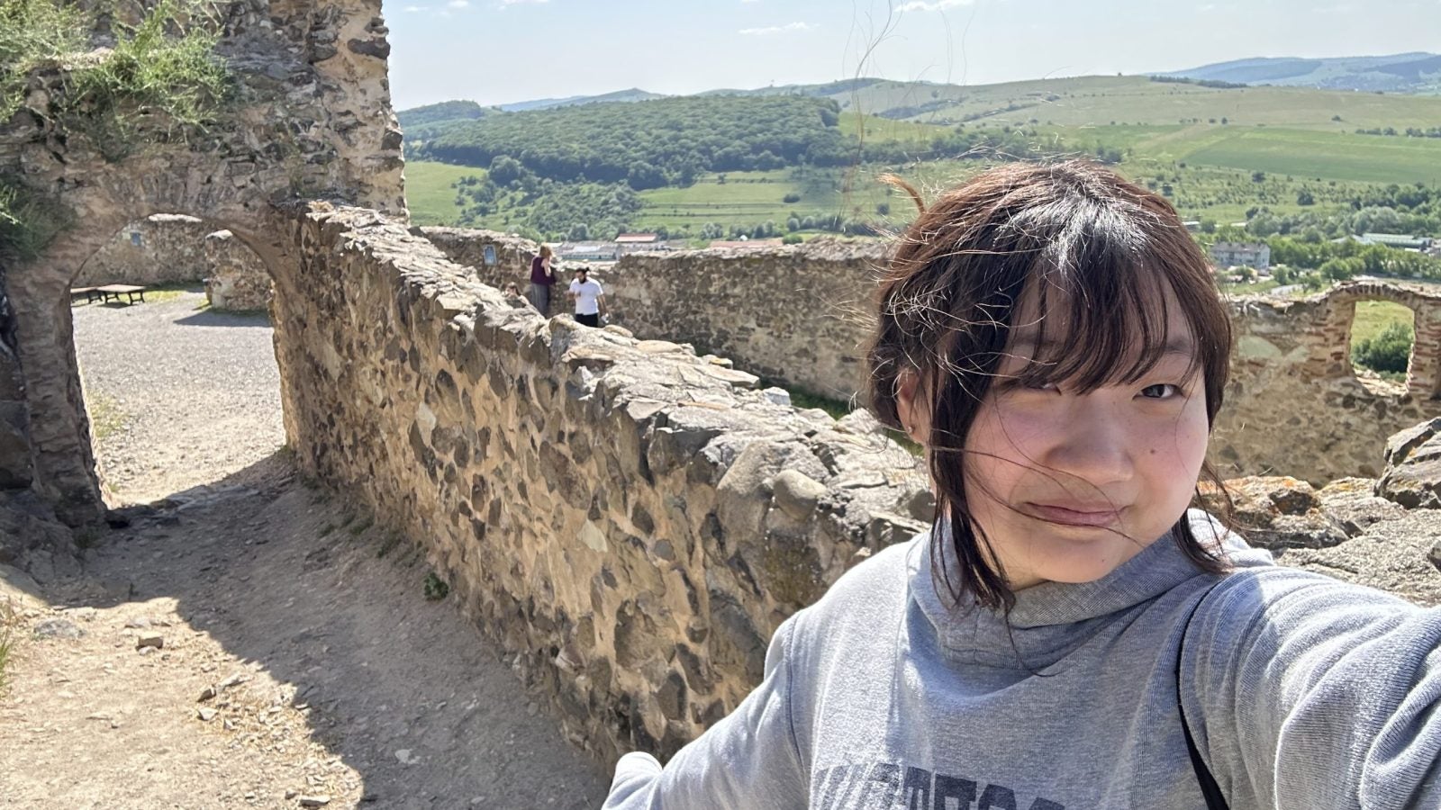 Young Asian woman in some ruins in Romania
