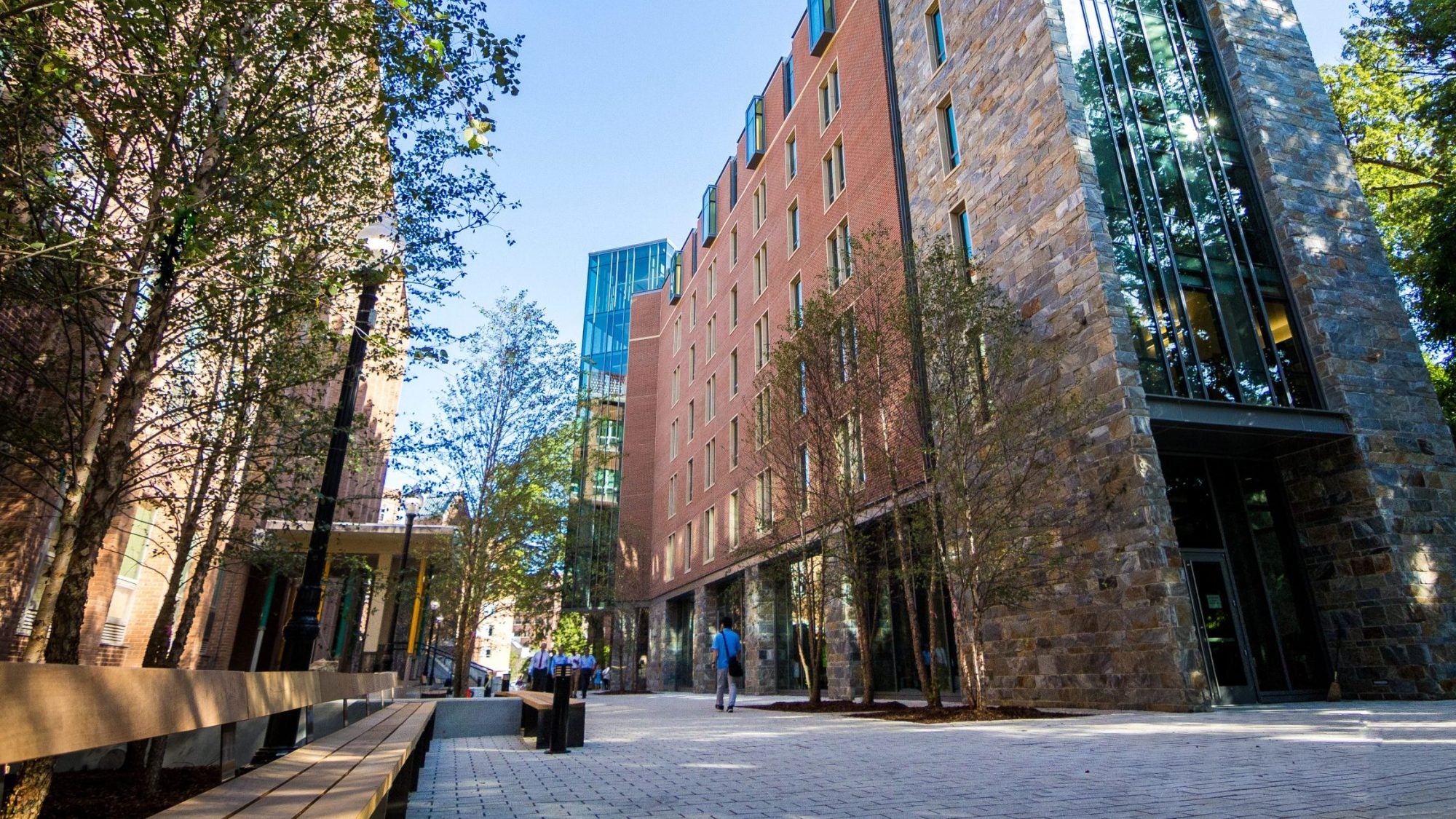 A walkway through two buildings on a sunny day
