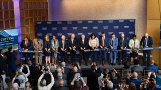 University and city leaders cut a ribbon