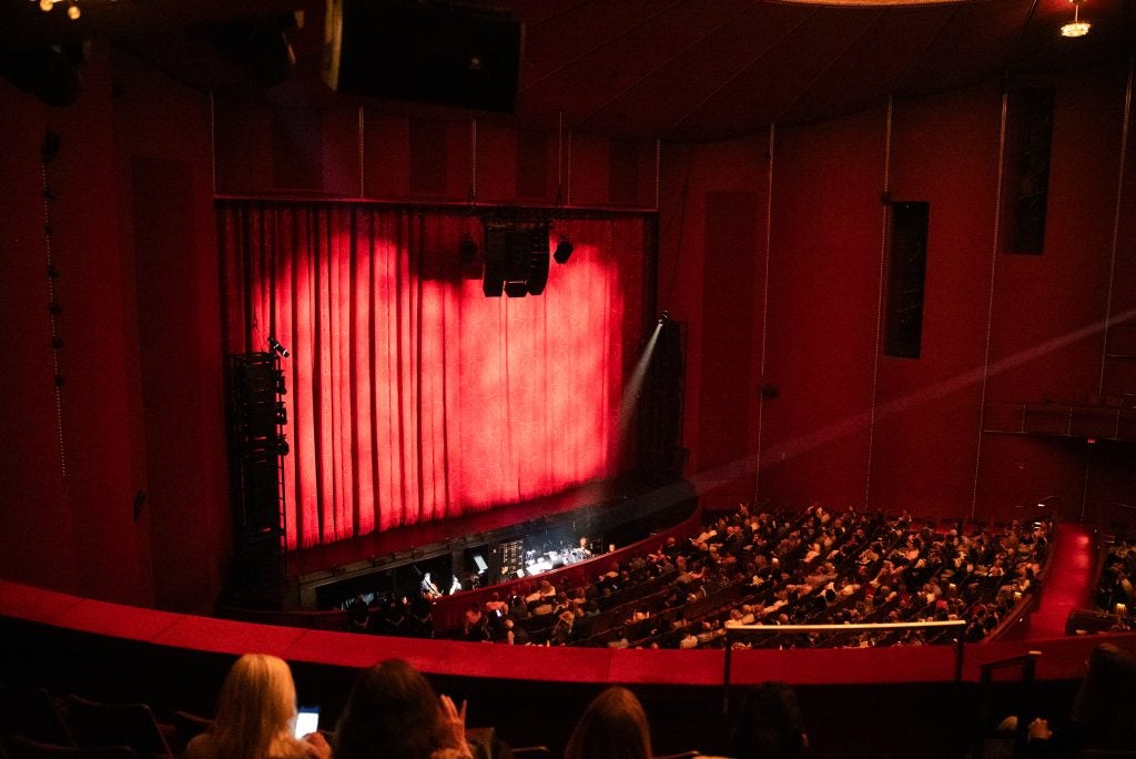 Dimly lit theater getting ready for a show