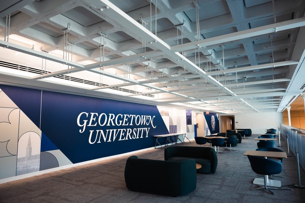 Common lounge space at 111 Massachusetts Ave with a large logo for Georgetown