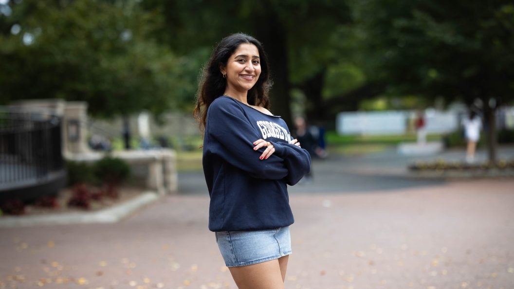Harnoor in a blue GU sweatshirt on a fall day