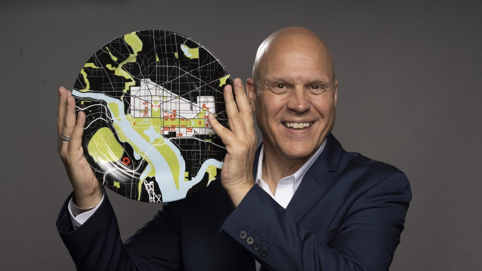 Former Washington Post Food Critic Tom Sietsema poses with a plate in revealing his face to readers for the first time after being undercover