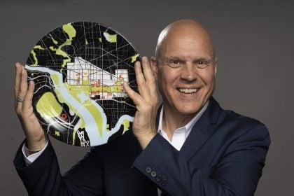 Former Washington Post Food Critic Tom Sietsema poses with a plate in revealing his face to readers for the first time after being undercover