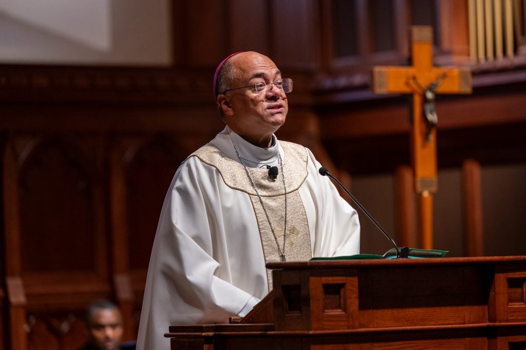 A bishop in clerical robes speaking in Dahlgren Chapel