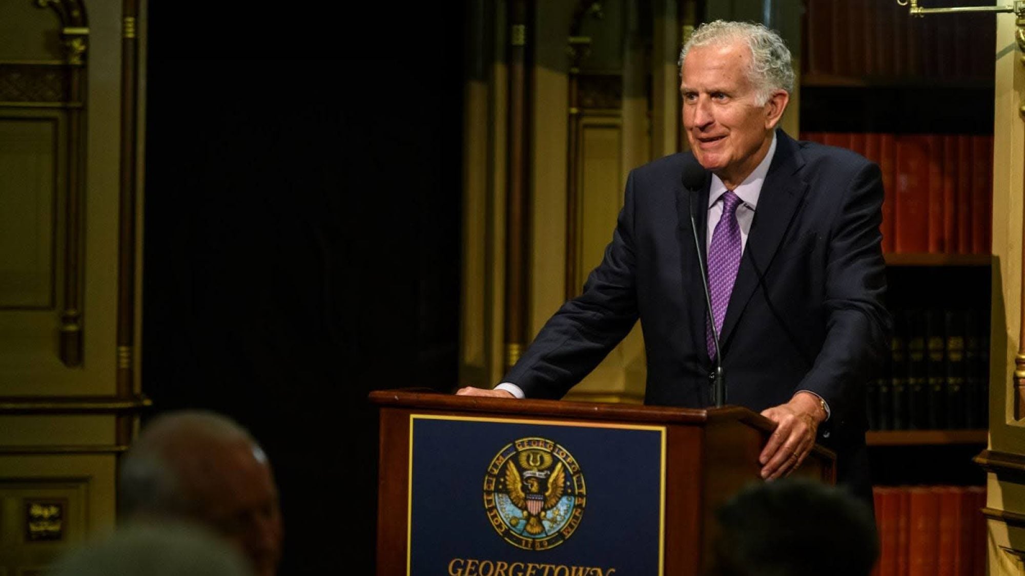 Paul Tagliabue standing at a Georgetown podium.