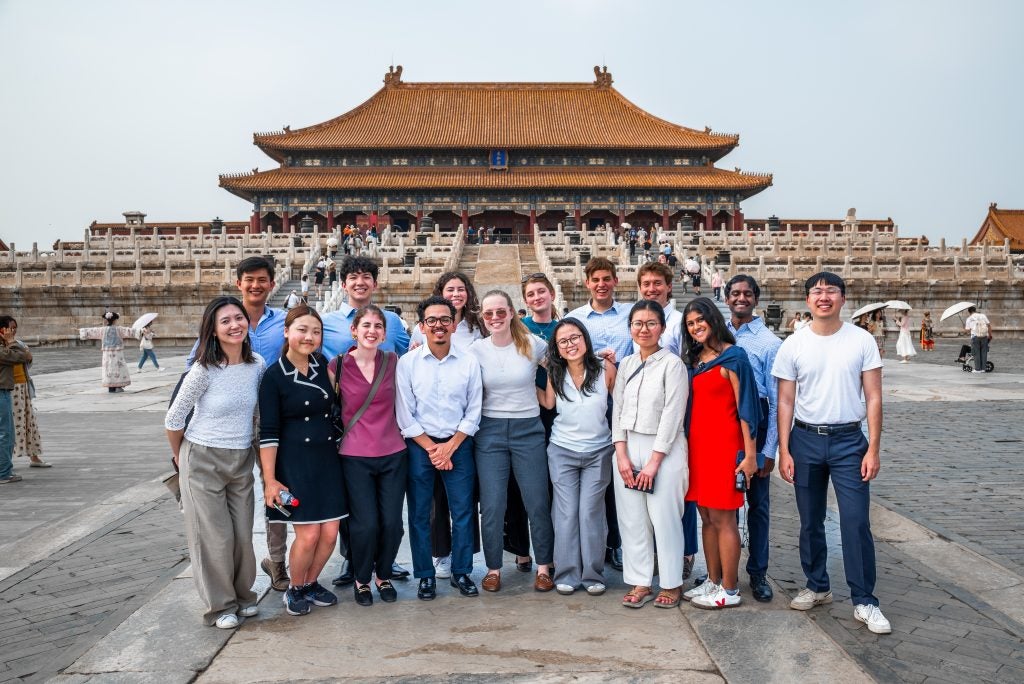 A group of students outside of a famous landmark in China
