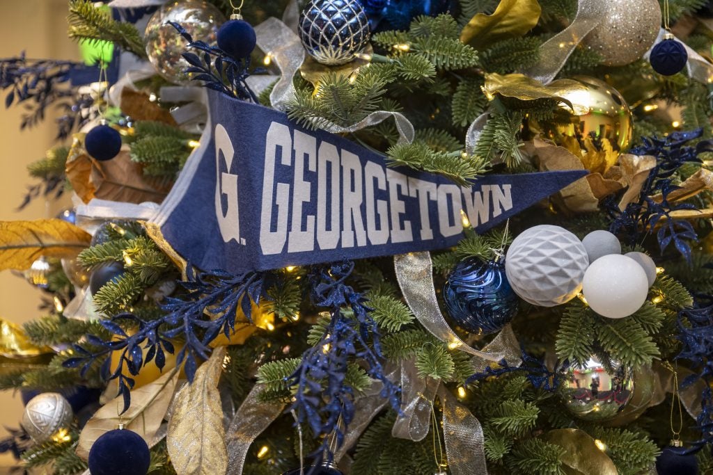 A Georgetown banner ornament on a Christmas tree