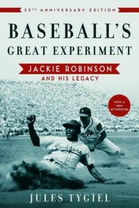 A black and white photo on a book cover of two men playing baseball with the title "Baseball's Great Experiment"