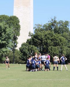 People playing rugby on the National Mall