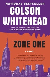 A pink and orange book cover with a skyline and the title "Zone One" by Colson Whitehead