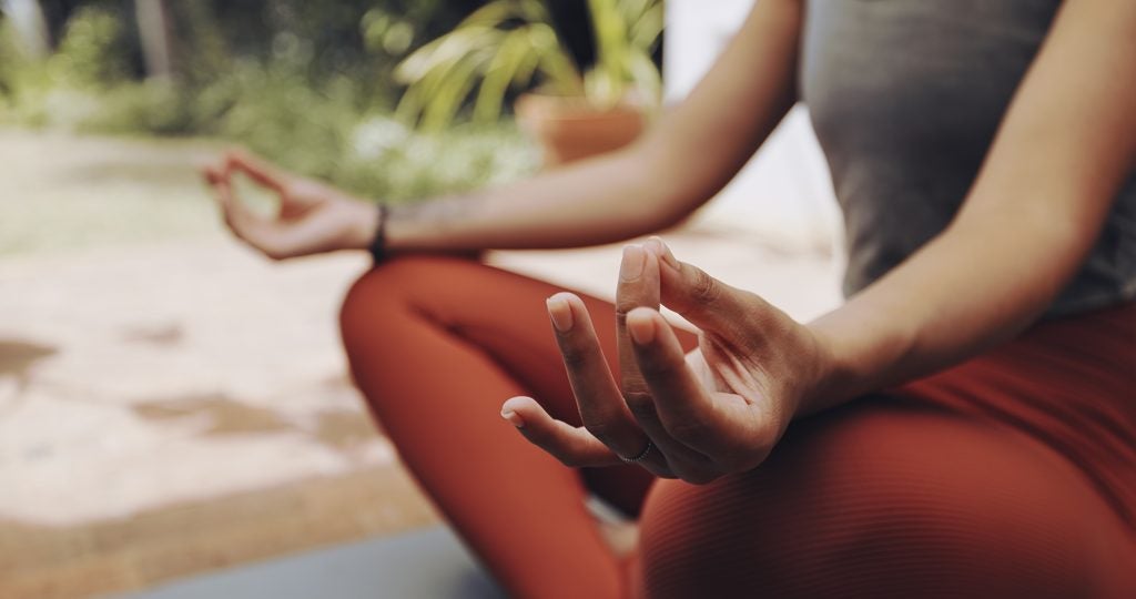 Woman, mudra hands and meditation for wellness