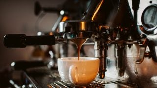 A cup of coffee is brewed