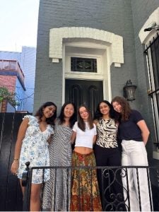 Five young women outside of a row home in Georgetown
