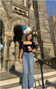 Harnoor standing on steps of Healy Hall