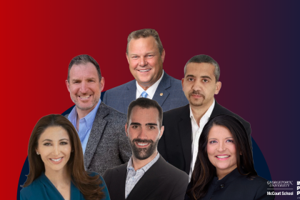A group of men and women in front of a red and purple background