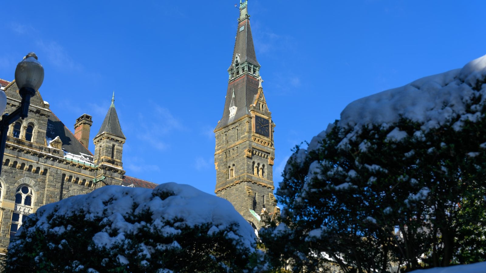A clocktower on a blue sunny day in the winter