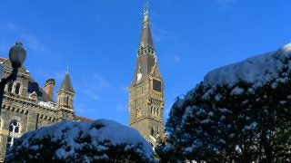A clocktower on a blue sunny day in the winter