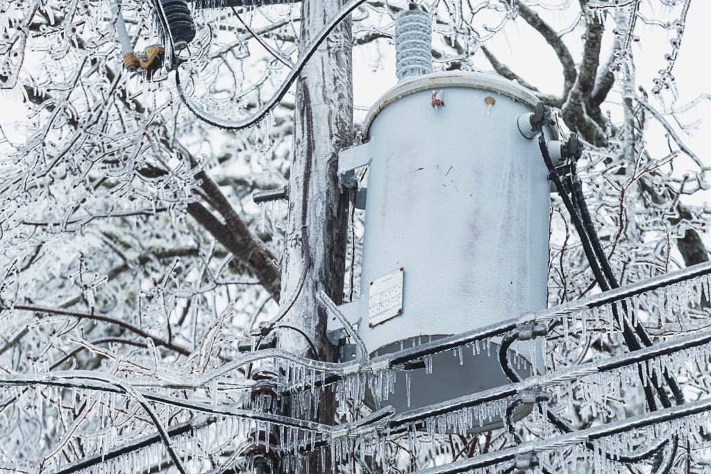 Icicles freeze over a power line in winter