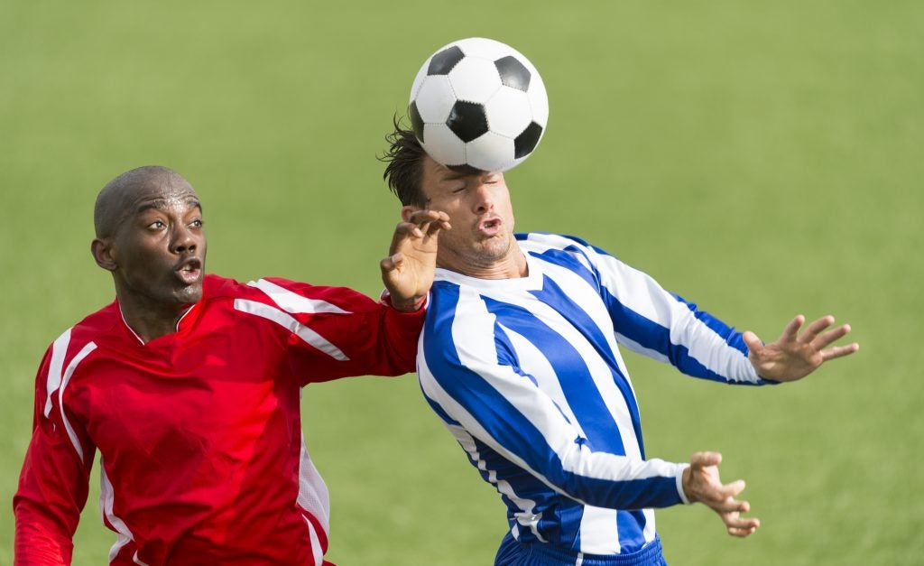 Two footballers in action